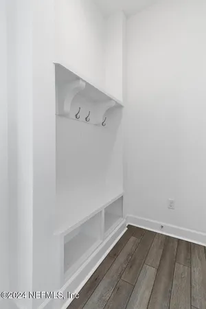 an aerial view of a house with a yard and lake view