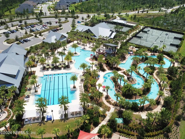 a view of kitchen with stainless steel appliances granite countertop cabinets and glass door