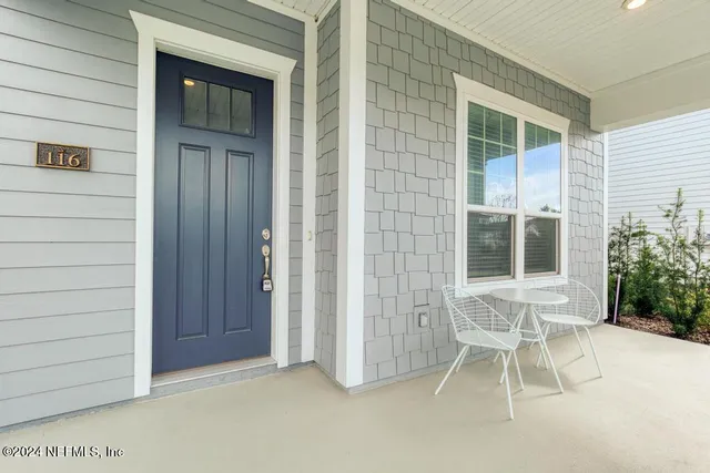 a view of a house with a door and chair