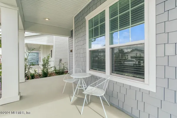 a view of a chair and table in a room