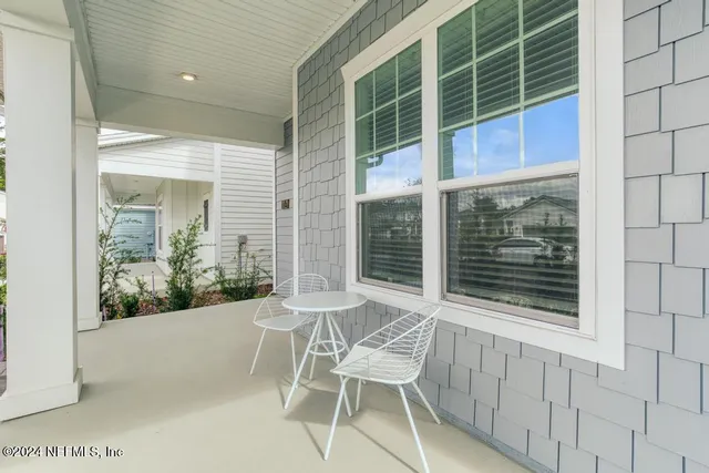 a view of a chair and table in a room