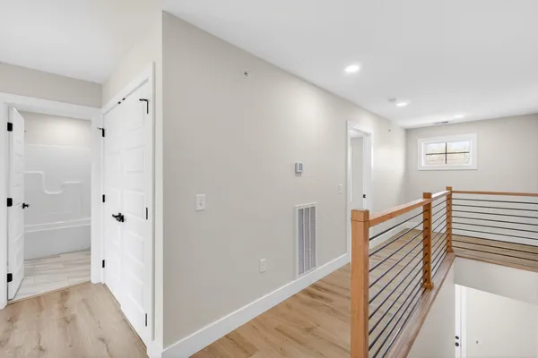 a view of a hallway with staircase