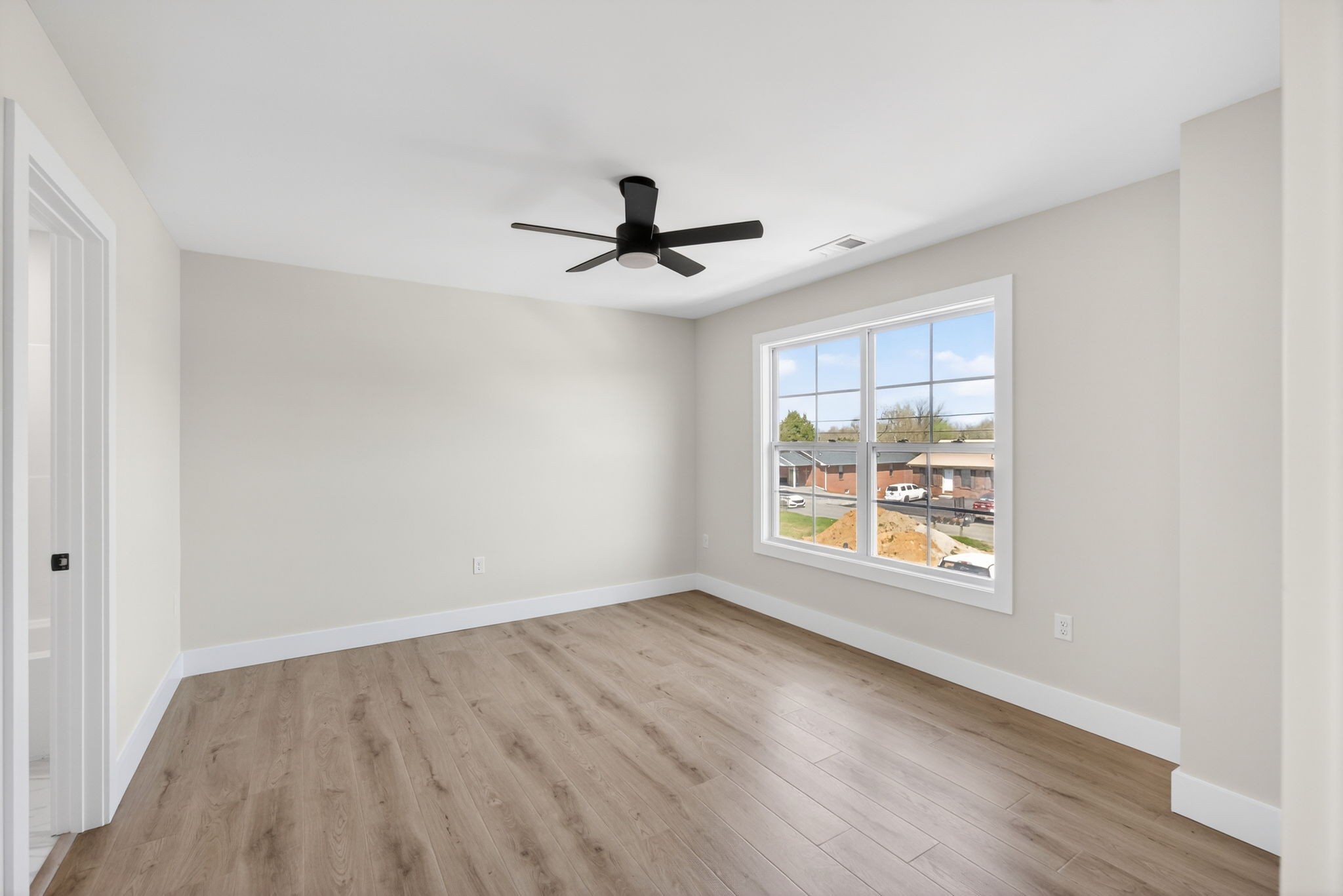 214 West Jere Whitson Road Cookeville, TN 38501 - Photo 20 of 31 an empty room with wooden floor and windows
