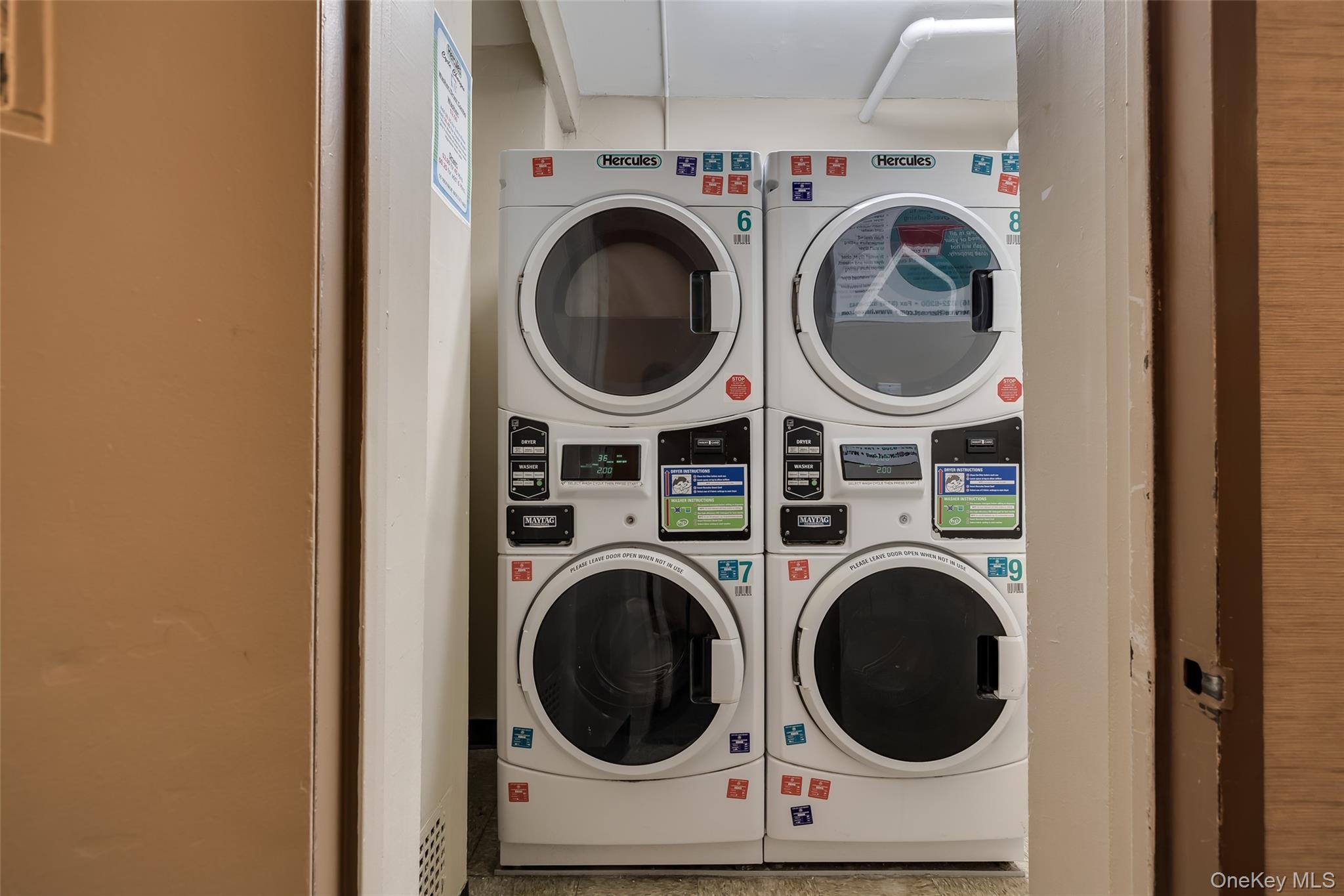 55 Monroe Boulevard, Unit 2L Long Beach, NY 11561 - Photo 20 of 25 a utility room with dryer and washer