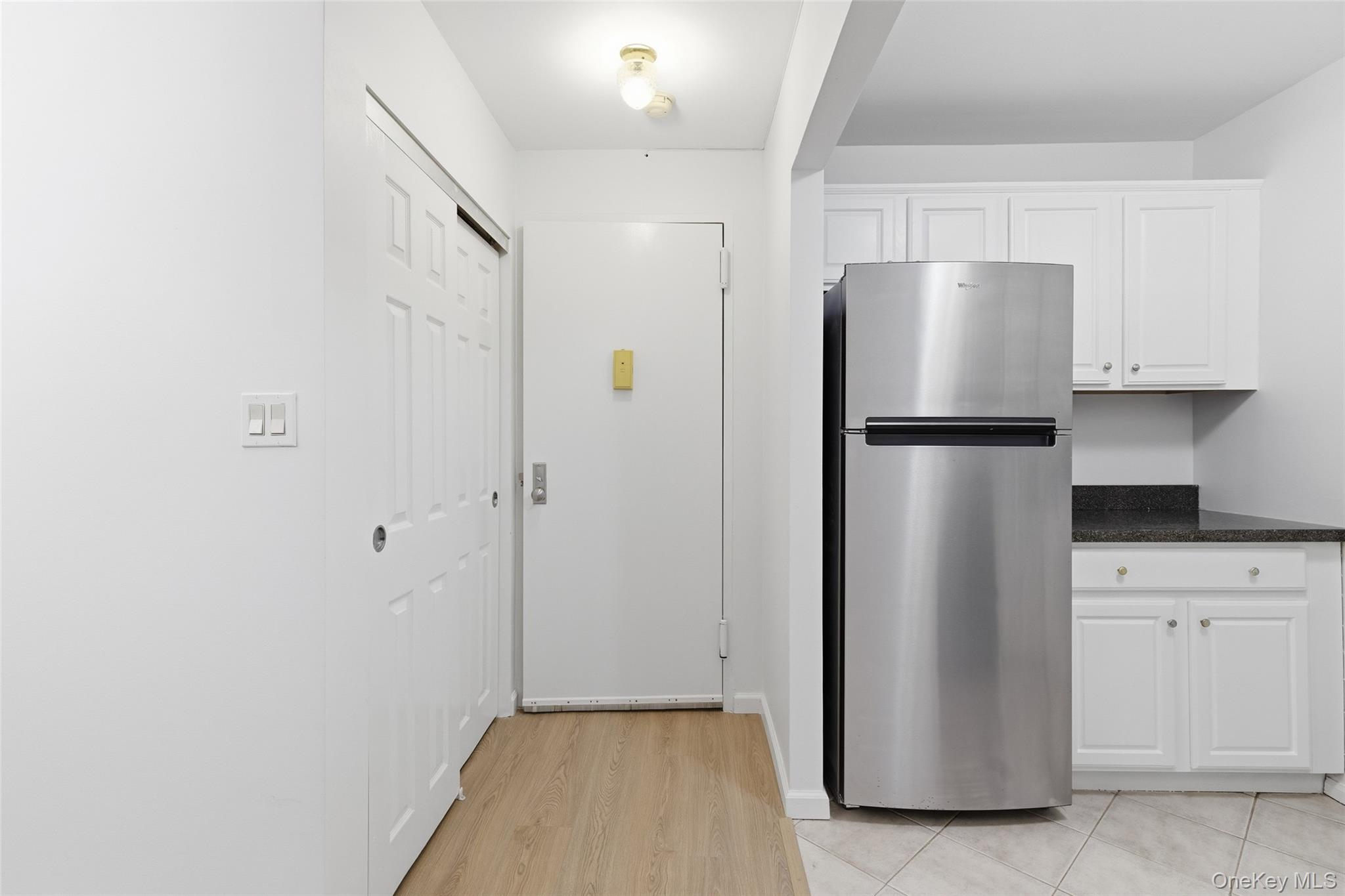55 Monroe Boulevard, Unit 2L Long Beach, NY 11561 - Photo 9 of 25 a view of kitchen with refrigerator stove and microwave