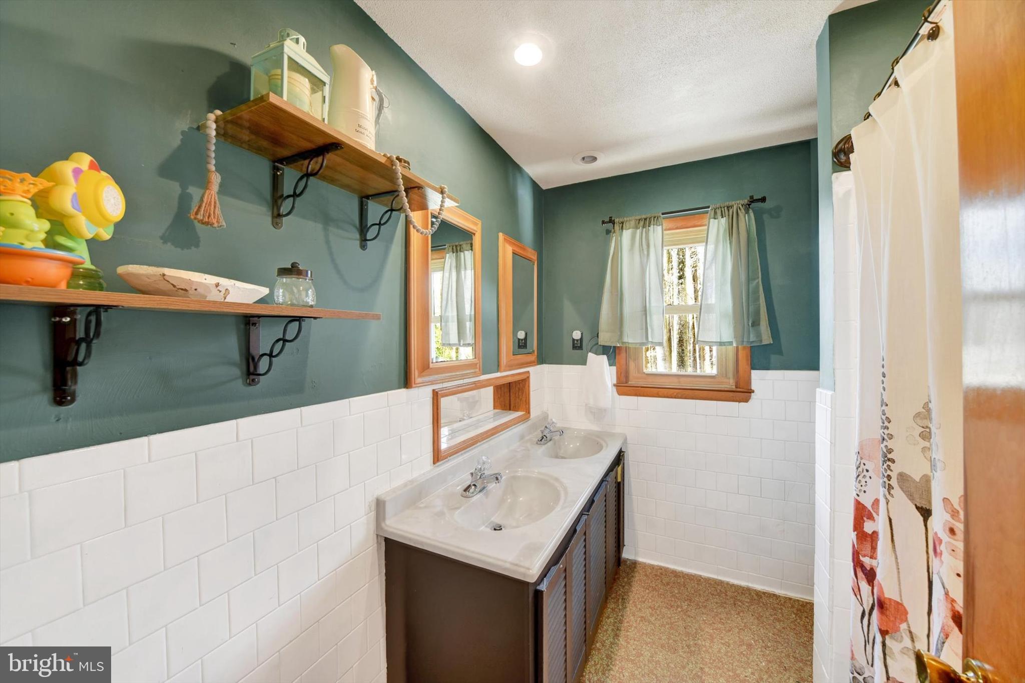 1504 Groveton Court Fallston, MD 21047 - Photo 18 of 29 a hallway with a table and chairs