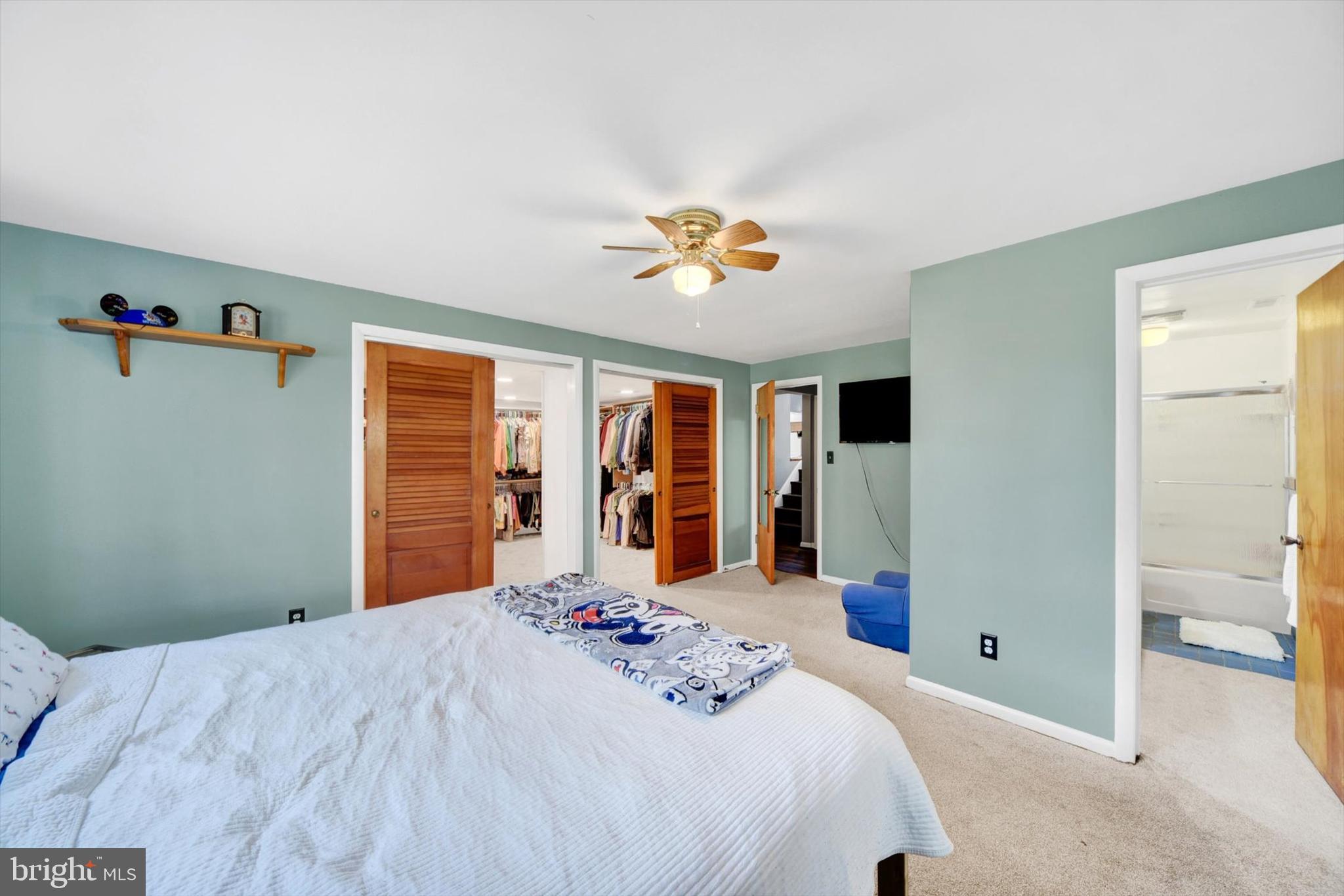 1504 Groveton Court Fallston, MD 21047 - Photo 25 of 29 a bedroom with a bed and a chandelier
