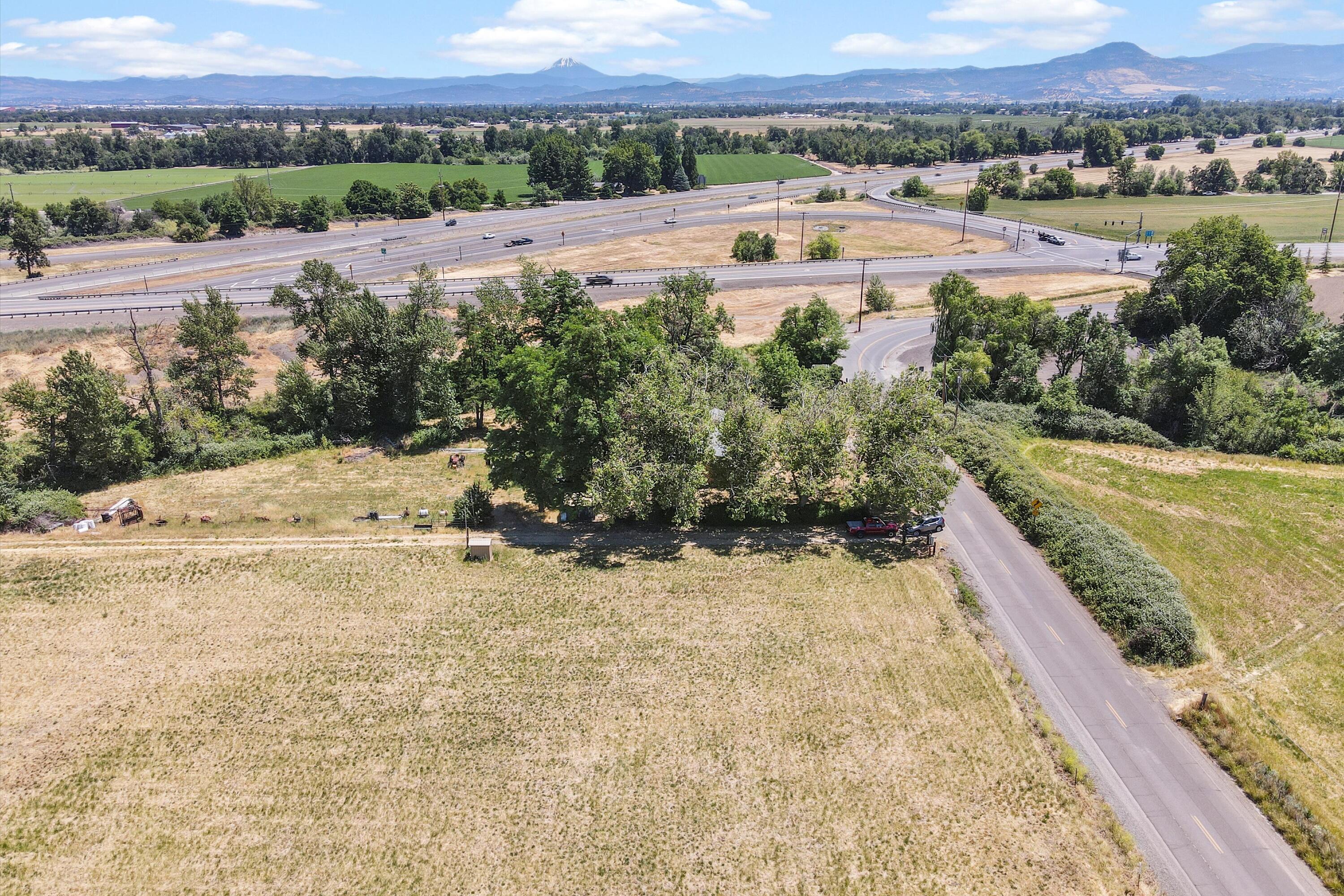 2908 Willow Springs Road Central Point, OR 97502 - Photo 7 of 34 an aerial view of a house with a yard and lake view