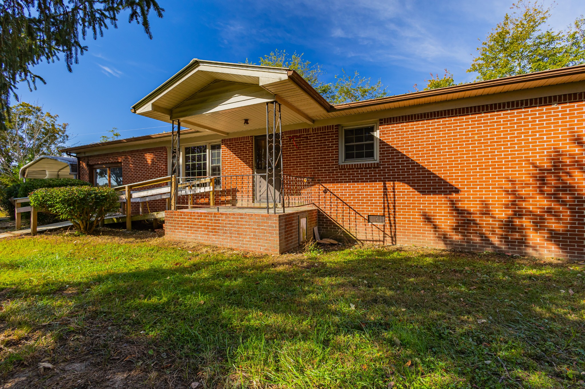 340 Yates Road Hillsboro, TN 37342 - Photo 12 of 69 a view of a big house with a big yard and potted plants