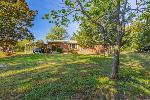 a view of a house with a big yard