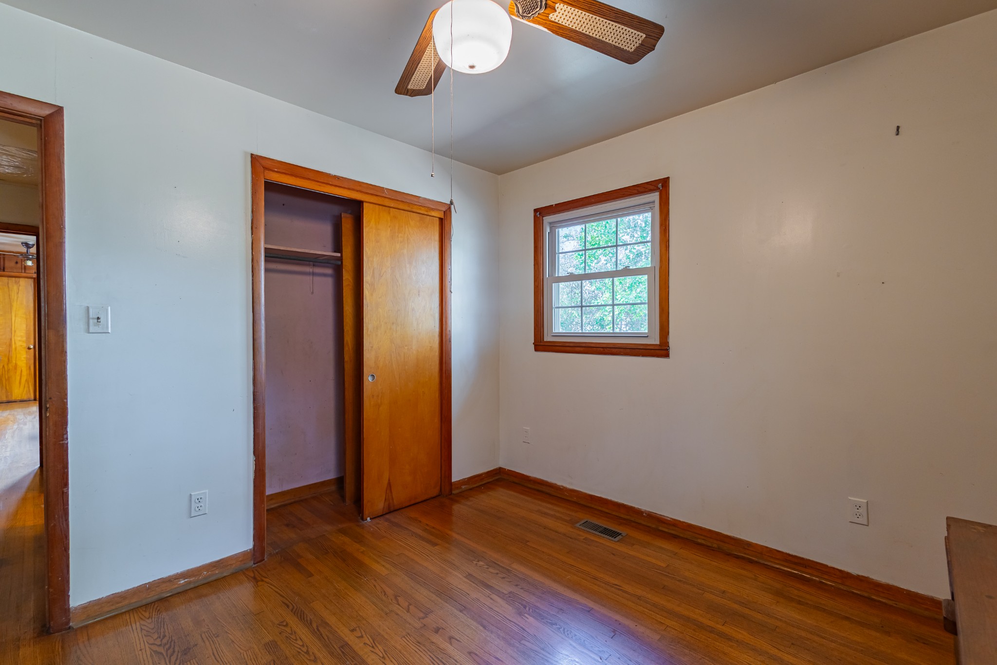 340 Yates Road Hillsboro, TN 37342 - Photo 37 of 69 an empty room with wooden floor closet and windows