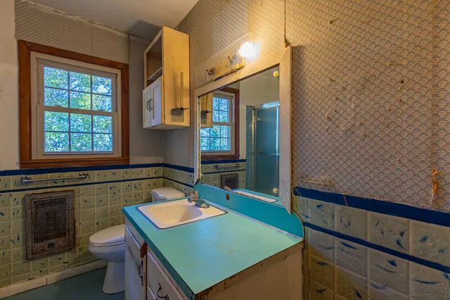 an aerial view of a house with yard and outdoor seating
