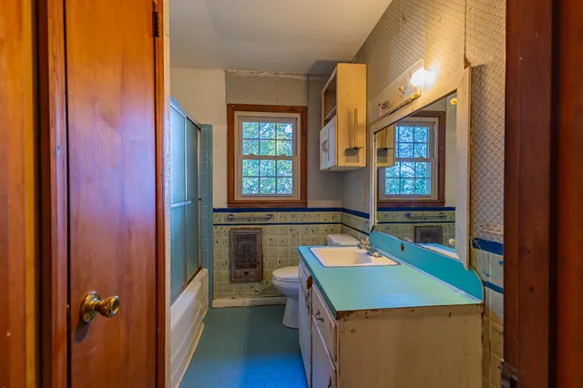 an aerial view of a houses with a lake view