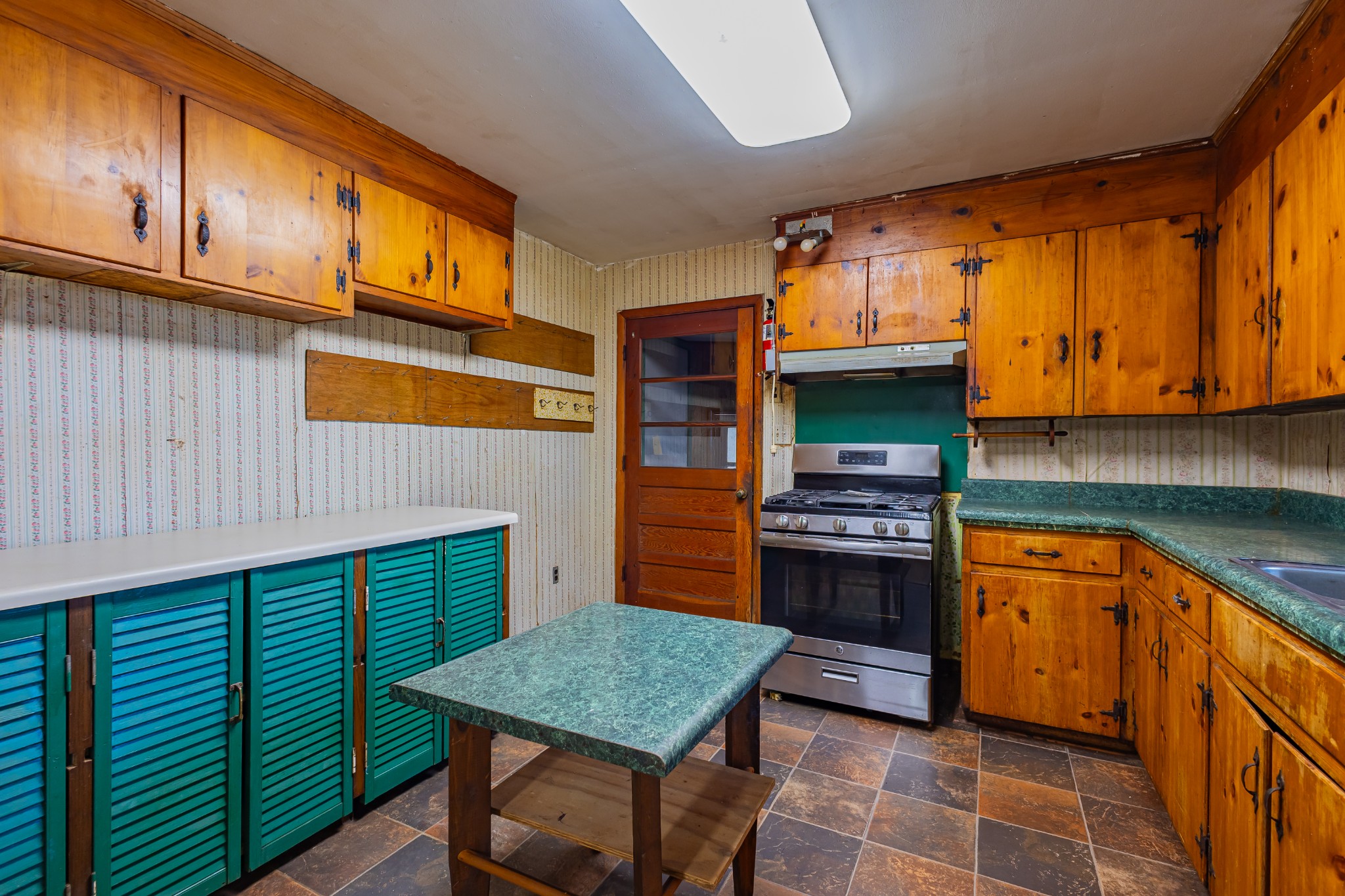 340 Yates Road Hillsboro, TN 37342 - Photo 43 of 69 a kitchen with stainless steel appliances granite countertop a stove a sink and a microwave