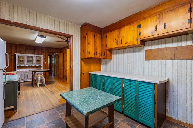 a view of a lake with houses in the back