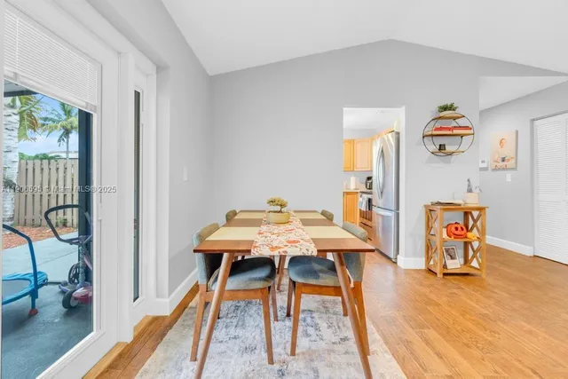 a view of a room that has a table and a chair