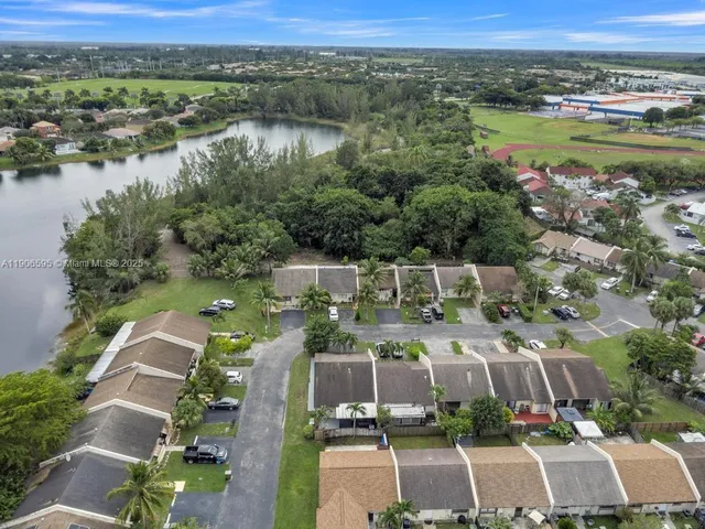 an aerial view of a house with a lake view