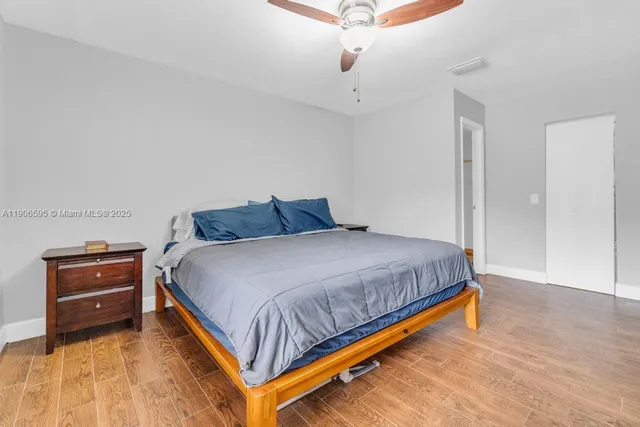 a bedroom with a bed and dresser