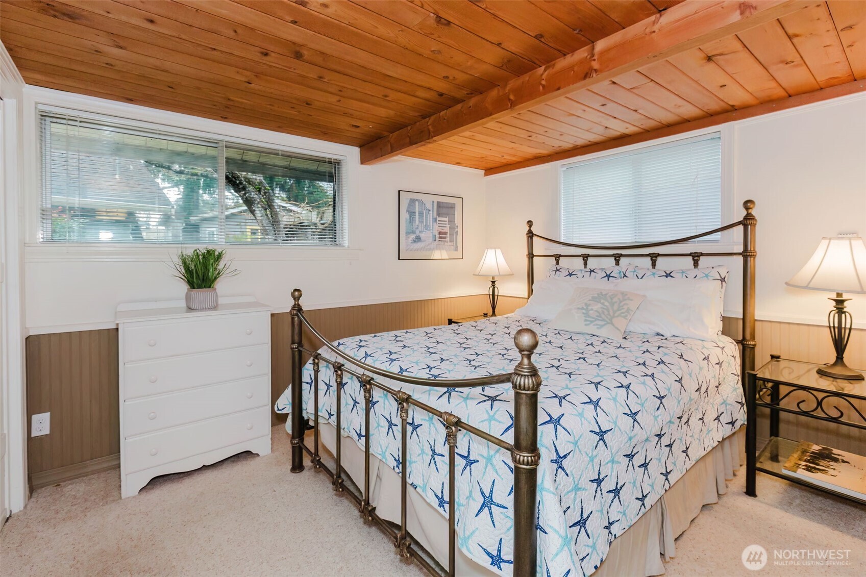 10271 Northeast North Shore Road Belfair, WA 98528 - Photo 21 of 38 a bedroom with a bed and a table