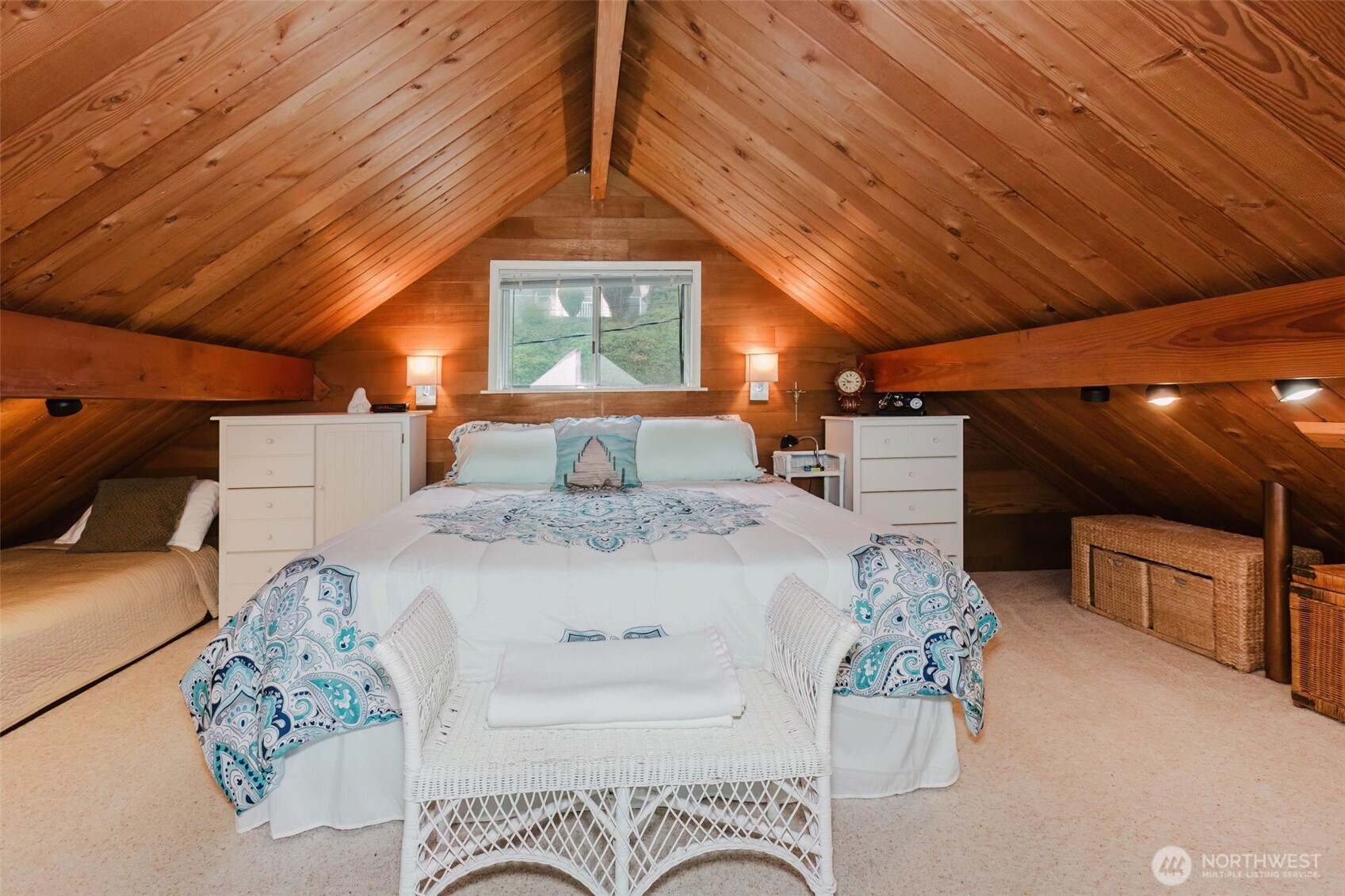 10271 Northeast North Shore Road Belfair, WA 98528 - Photo 26 of 38 a spacious bedroom with a bed and a chandelier