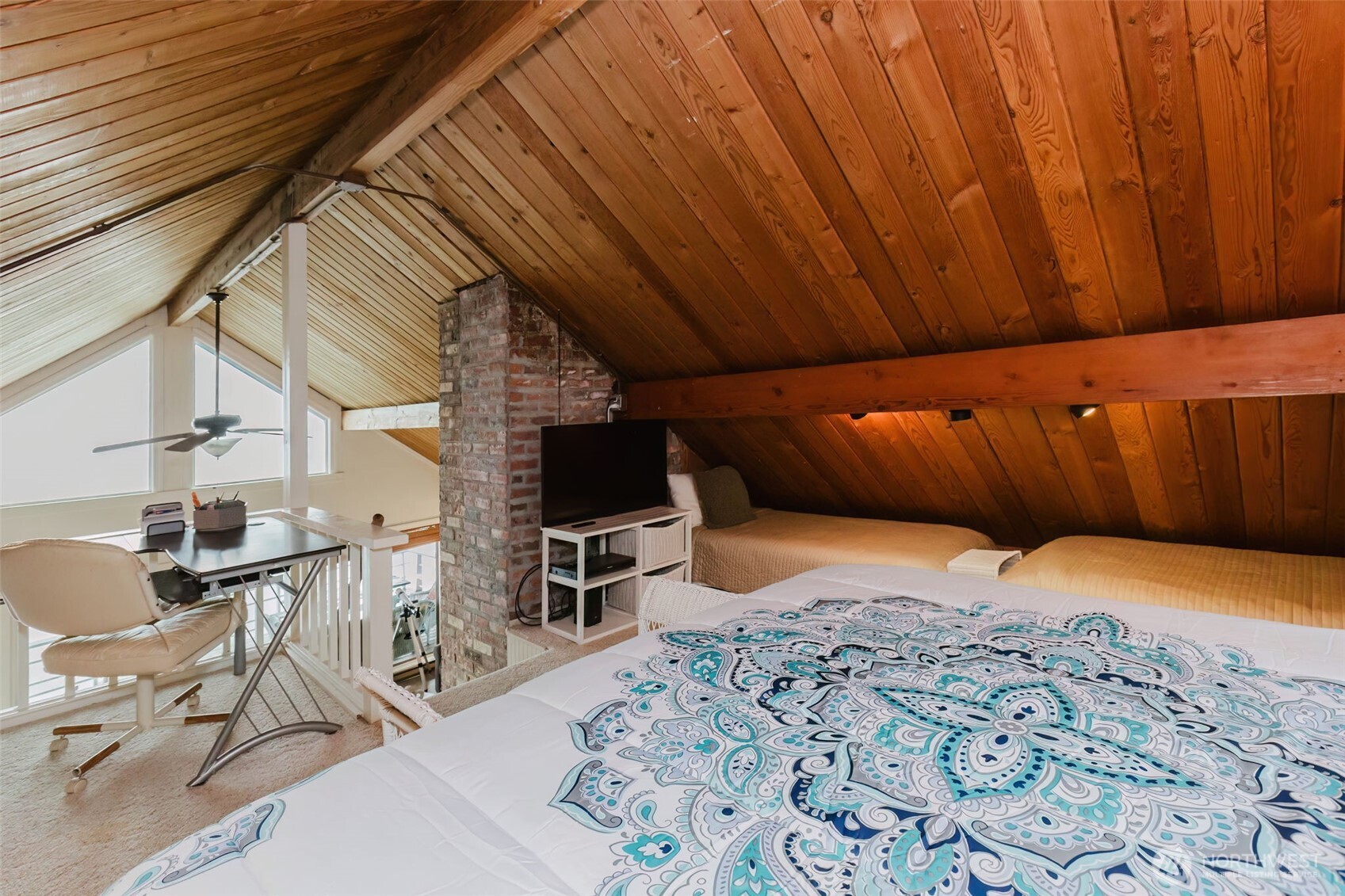 10271 Northeast North Shore Road Belfair, WA 98528 - Photo 27 of 38 a bed room with a bed and a chair