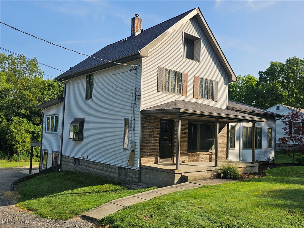 1325 Ohltown McDonald Road Mineral Ridge, OH 44440 - Photo 2 of 33 View of front of home featuring covered porch and a front yard