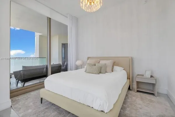 a bedroom with a bed and ceiling fan