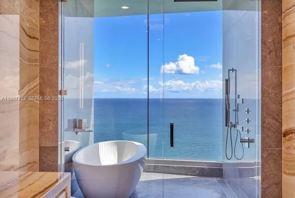a bathroom with a bathtub sink and toilet