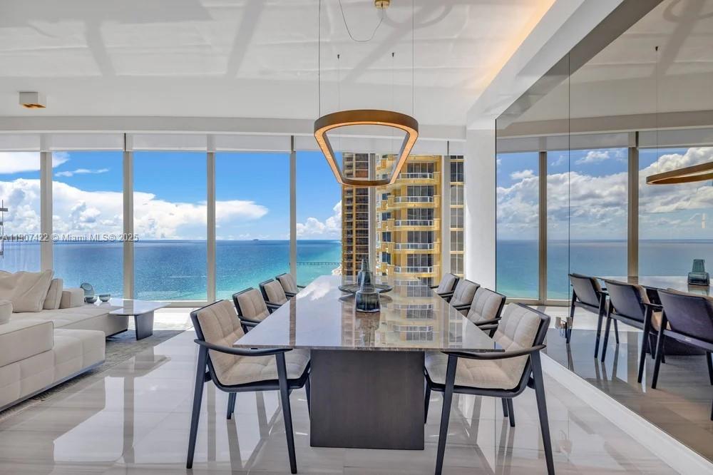 17901 Collins Avenue, Unit 2604 Sunny Isles Beach, FL 33160 - Photo 8 of 28 a view of a dining room with furniture window and outside view