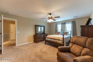 338 Pistole Road Sparta, TN 38583 - Photo 20 of 39 a bedroom with a bed couch and dresser
