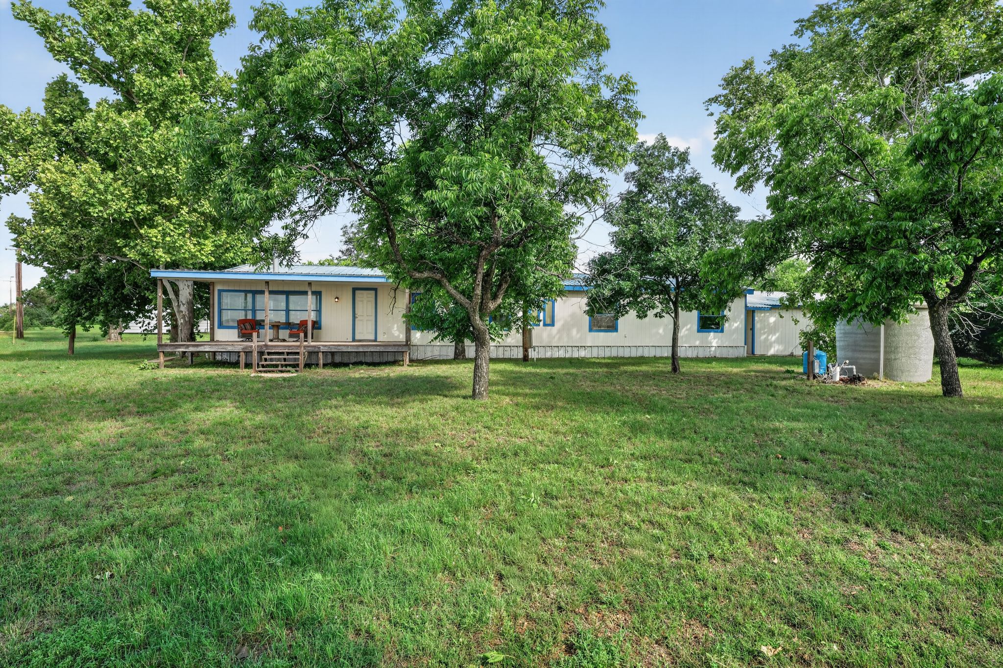1192 County Road 225 Bluffton, TX 78607 - Photo 38 of 38 Single-story residence featuring an expansive lawn and mature trees