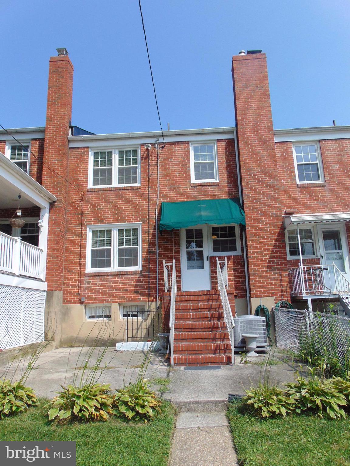 1513 Dellsway Road Baltimore, MD 21286 - Photo 2 of 19 Awning Over Door Cement Patio Landscaped
