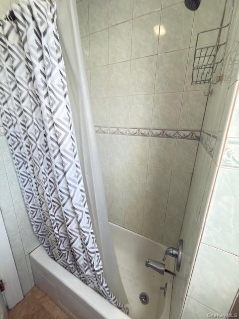 48 Church Street Patchogue, NY 11772 - Photo 12 of 19 a bathroom with a shower and toilet