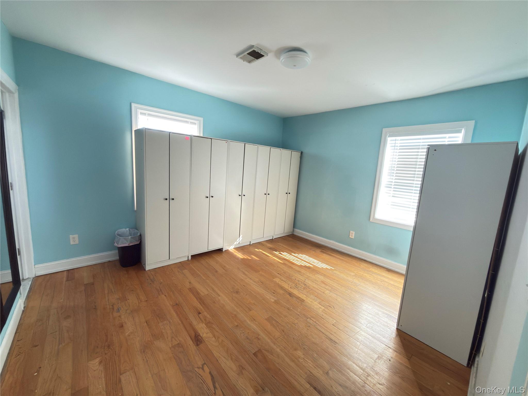 48 Church Street Patchogue, NY 11772 - Photo 8 of 19 a view of empty room with wooden floor