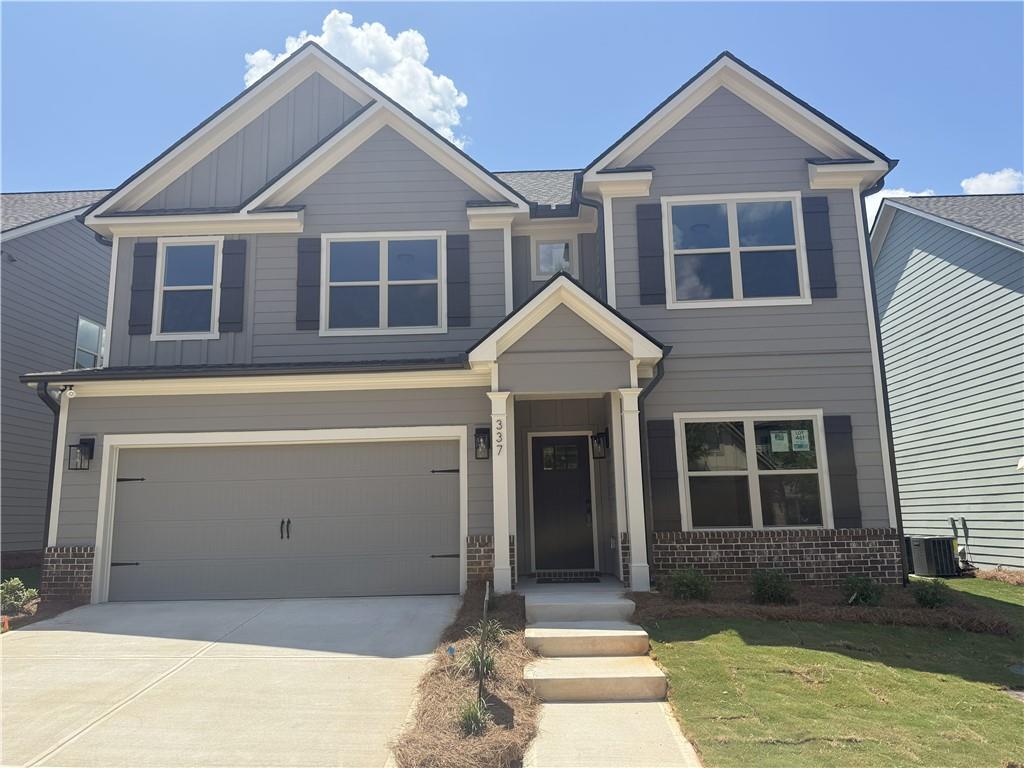 337 Ridge Pointe Drive Athens, GA 30606 - Photo 1 of 1 a front view of a house with a yard and garage