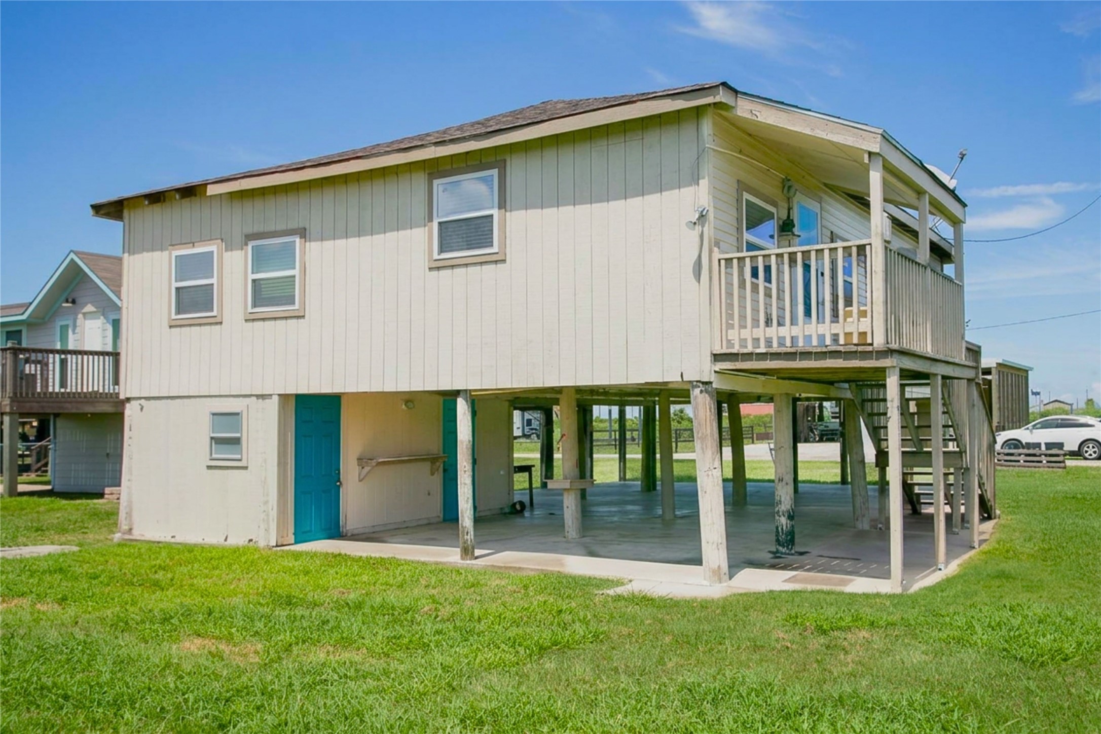 959 South East Road Crystal Beach, TX 77650 - Photo 3 of 20 a view of a house with backyard and porch