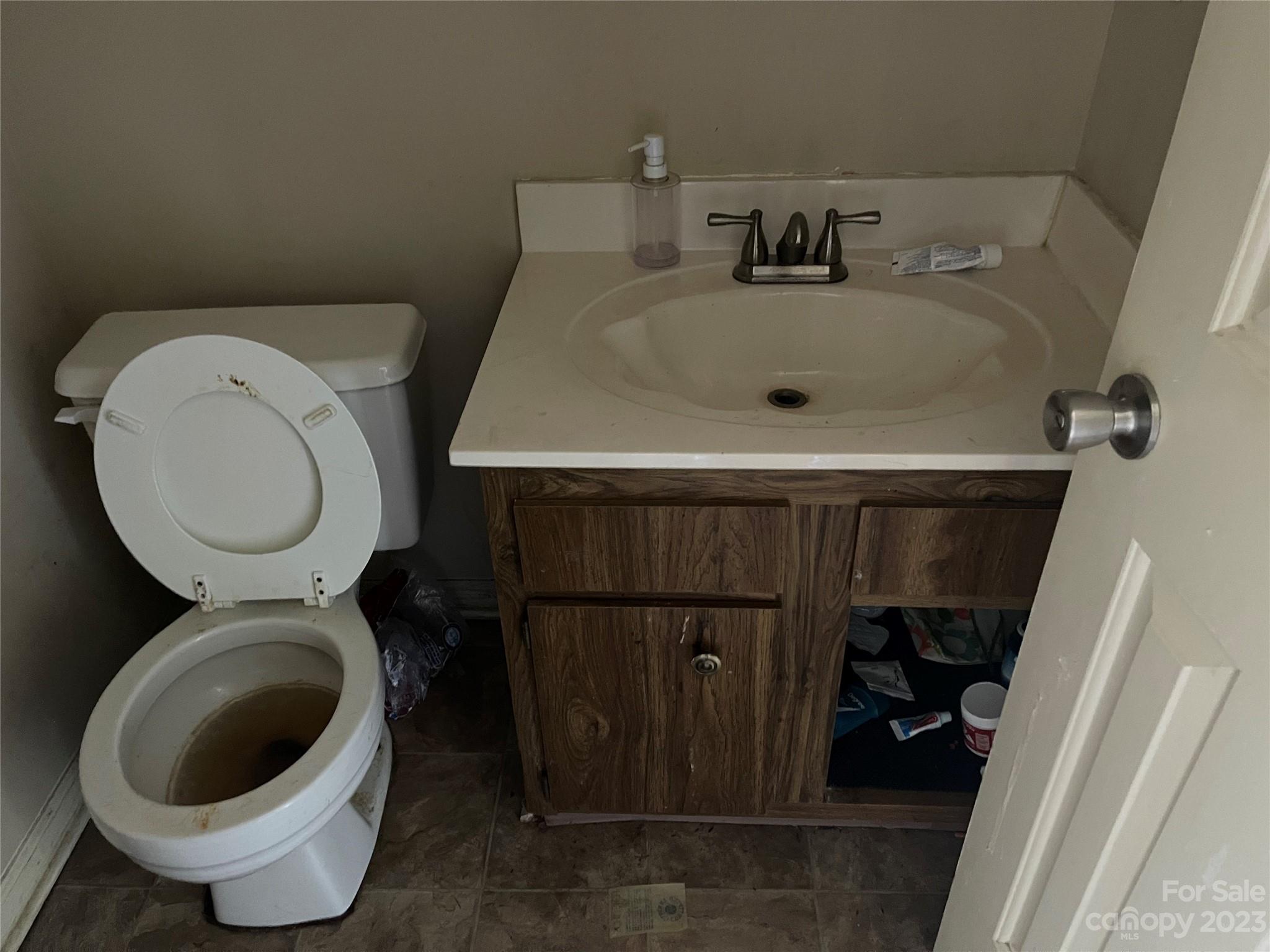 2940 Rural Hill Court Matthews, NC 28105 - Photo 4 of 24 a bathroom with a toilet and a sink