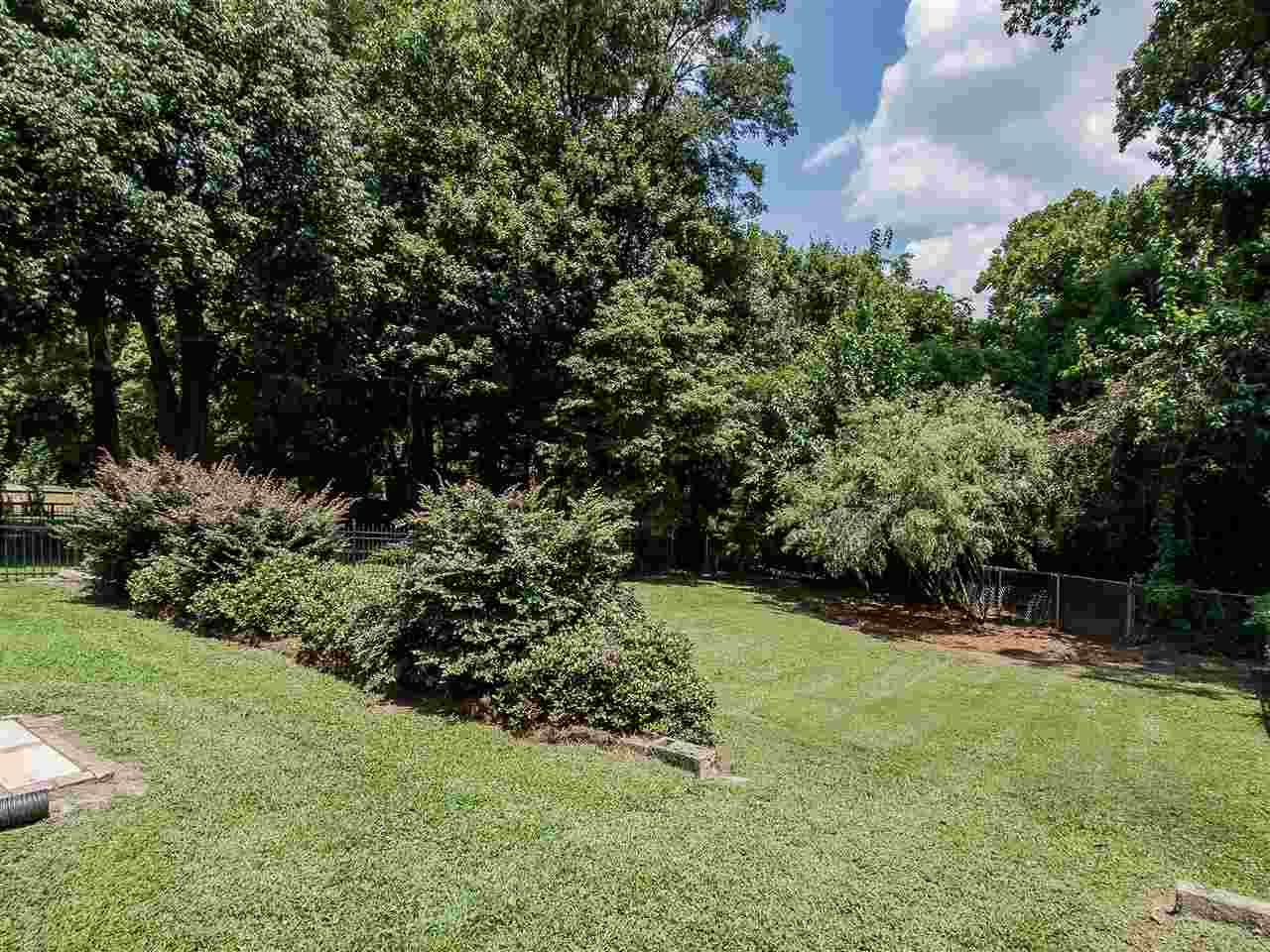 1634 Bickett Boulevard Raleigh, NC 27608 - Photo 22 of 25 One more view of the gorgeous, fenced back yard. Fenced Backyard