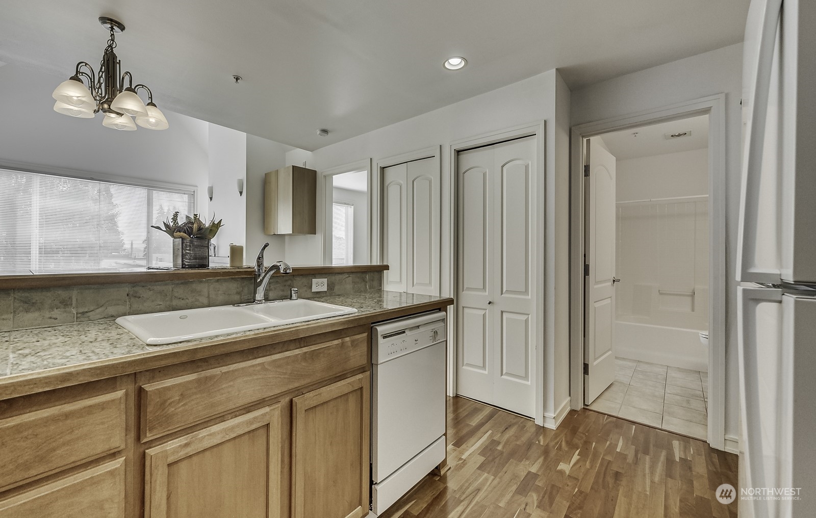 3121 West Government Way, Unit 405 Seattle, WA 98199 - Photo 12 of 29 a bathroom with a sink and a mirror