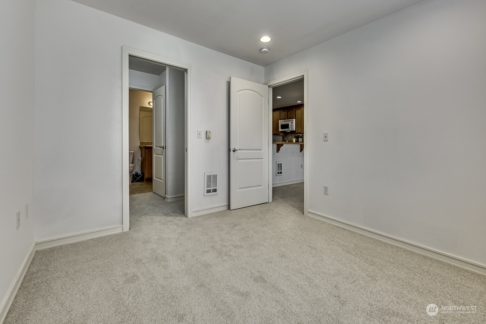 3121 West Government Way, Unit 405 Seattle, WA 98199 - Photo 14 of 29 an empty room with closet and a bathroom