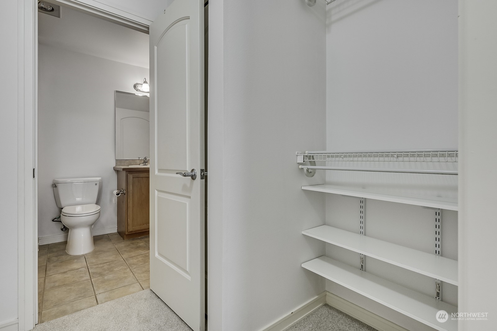 3121 West Government Way, Unit 405 Seattle, WA 98199 - Photo 16 of 29 a bathroom with a toilet and a shower