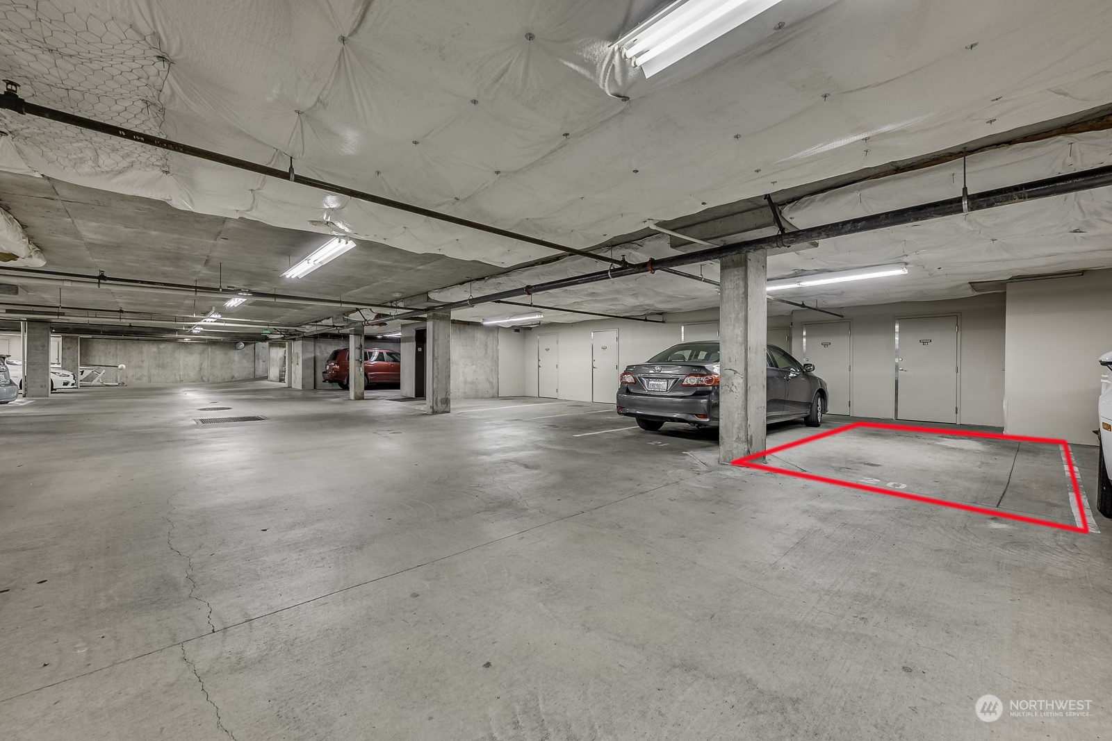 3121 West Government Way, Unit 405 Seattle, WA 98199 - Photo 20 of 29 a car parked in parking garage