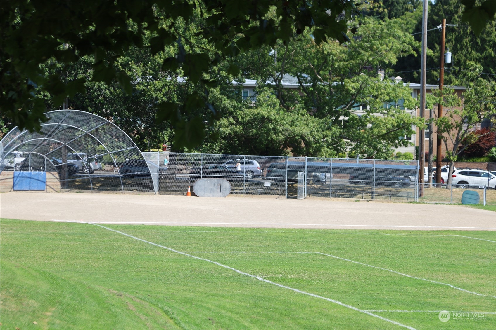 3121 West Government Way, Unit 405 Seattle, WA 98199 - Photo 24 of 29 a view of a yard and basketball court