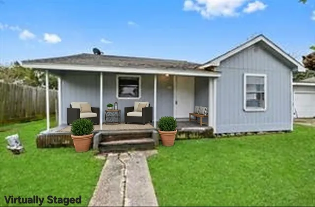 a front view of a house with garden