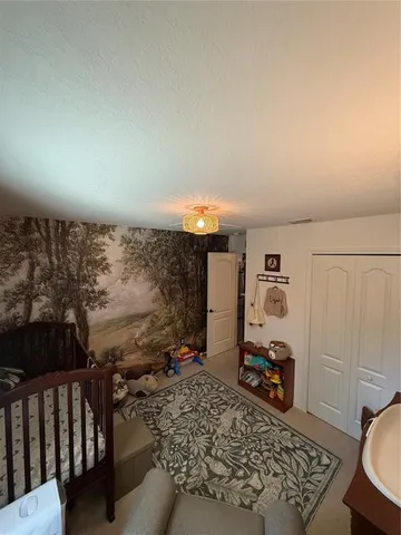 a bathroom with a sink a toilet and shower curtain