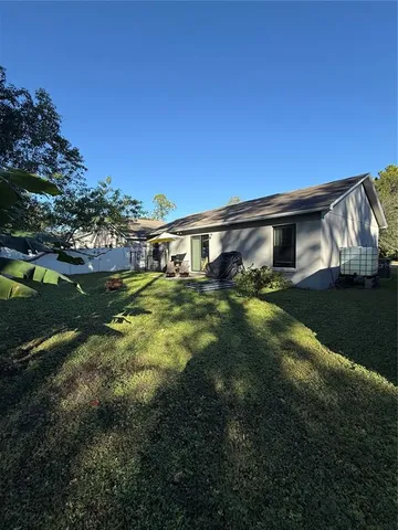 an aerial view of residential house with outdoor space