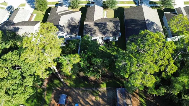 an aerial view of house with yard swimming pool and outdoor seating