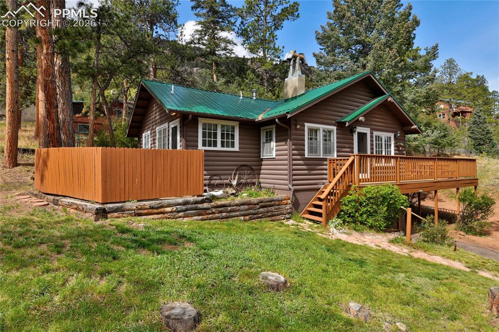 9455 Mohawk Trail Cascade, CO 80809 - Photo 2 of 33 Parking in the main drive but also a spot to access the kitchen door, perfect if you have just come from the grocery!