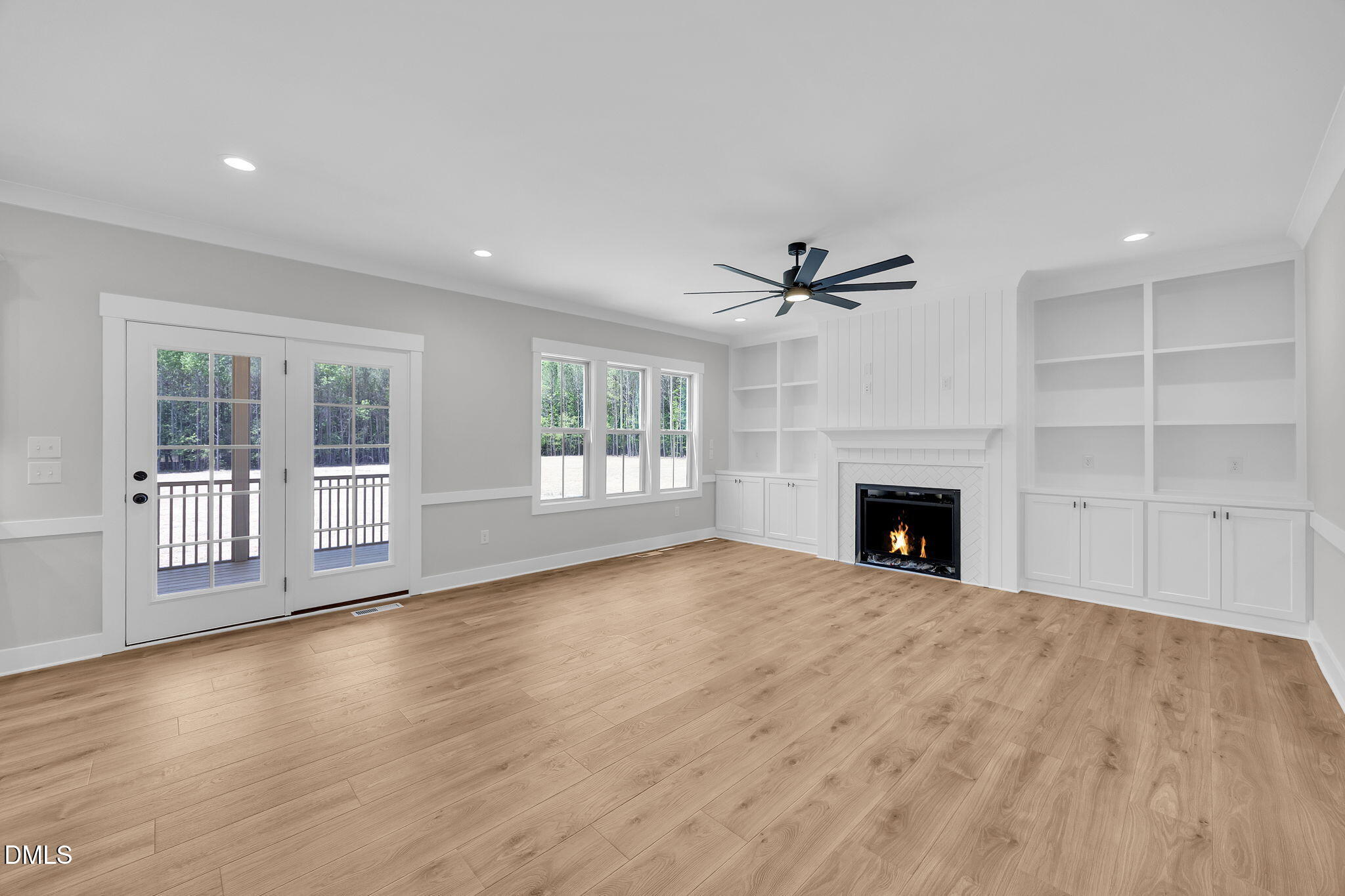 378 Freedom Ridge Drive Smithfield, NC 27577 - Photo 16 of 33 a view of an empty room with a fireplace and a window