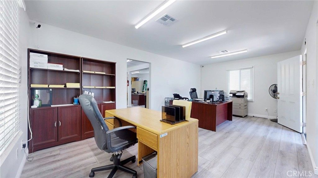 6851 Foothill Boulevard Tujunga, CA 91042 - Photo 16 of 50 a view of a workspace with furniture and wooden floor